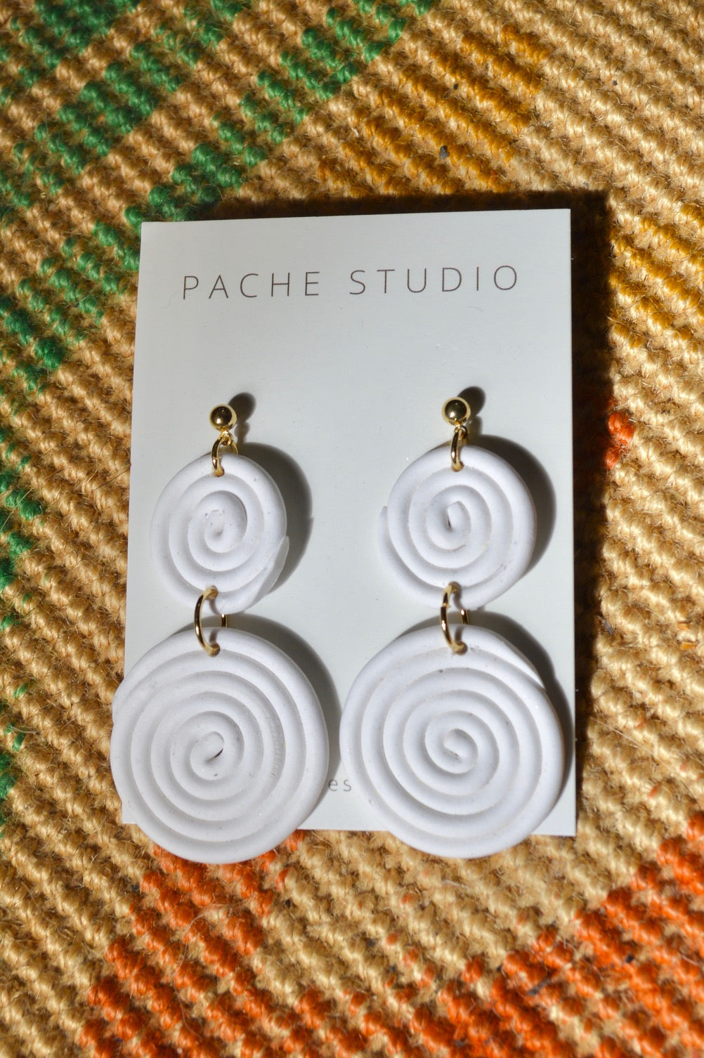 White spiral earrings