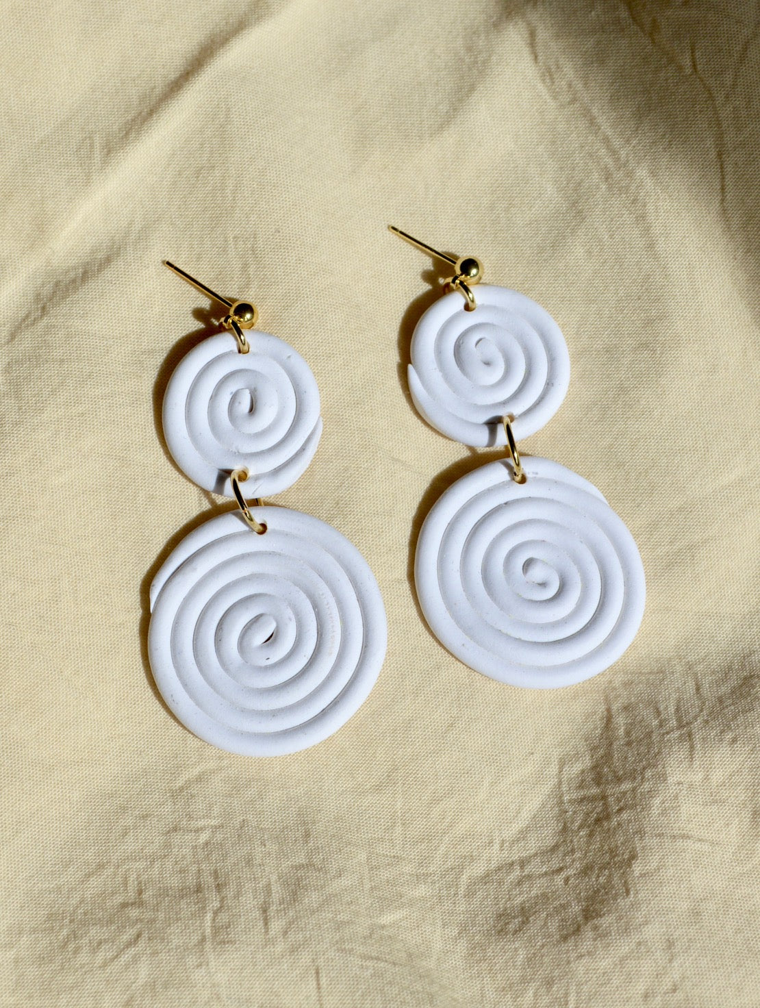 White spiral earrings