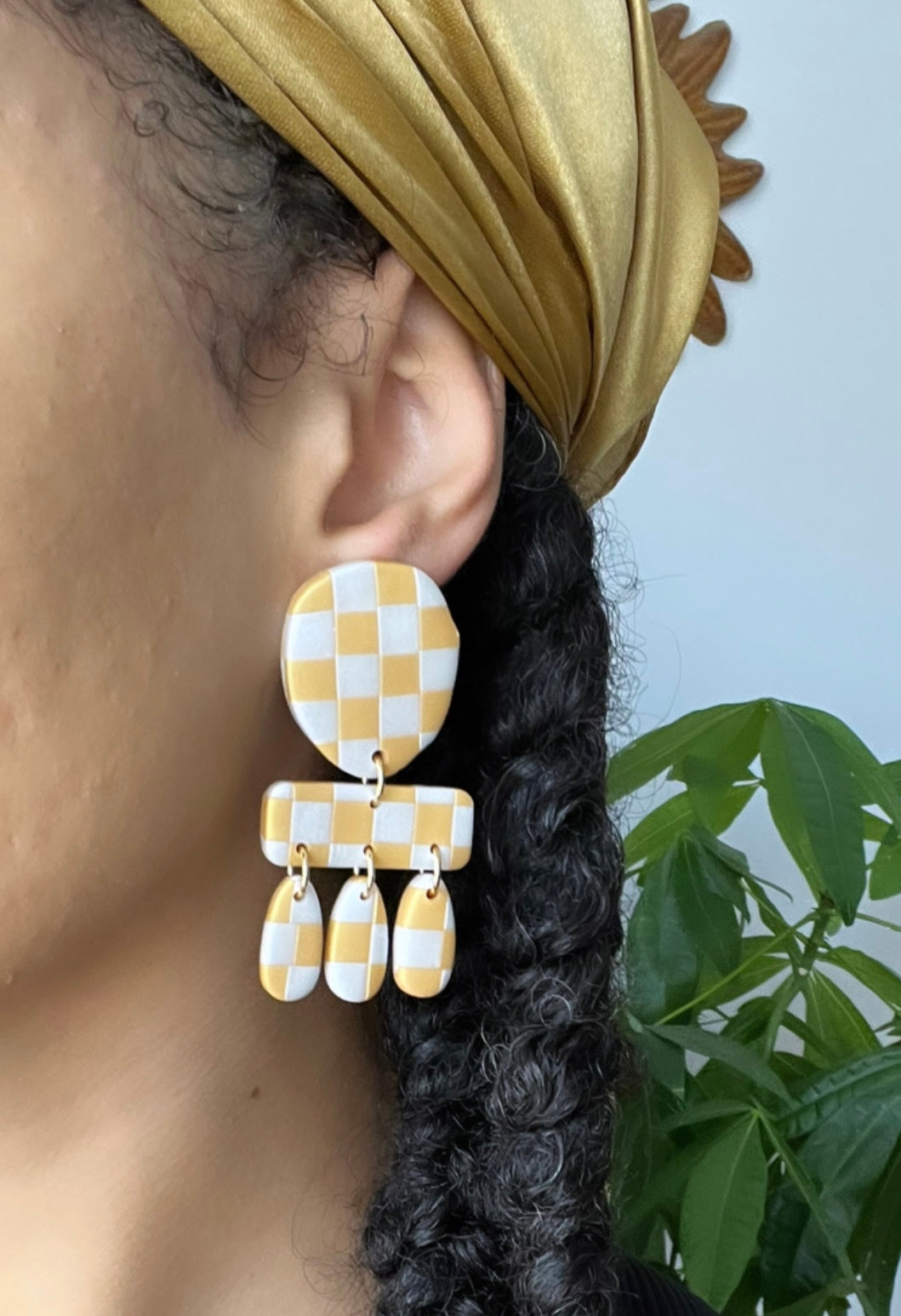 Gold and silver checkered clay earrings