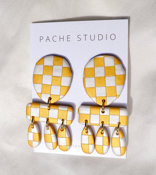 Gold and silver checkered clay earrings